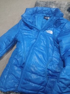 The North Face Blue Puffer Jacket with White Logo